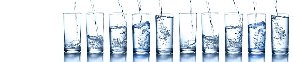 Glasses being filled with clean drinking water