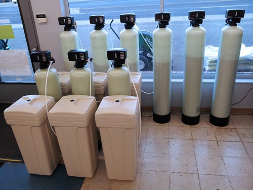 Water softener systems on the floor at Fisher's Supply in Canby, Oregon